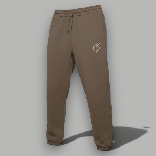 area 609 The Preservation Track Pants in walnut brown with an elastic drawstring waist and embroidered logo detail.