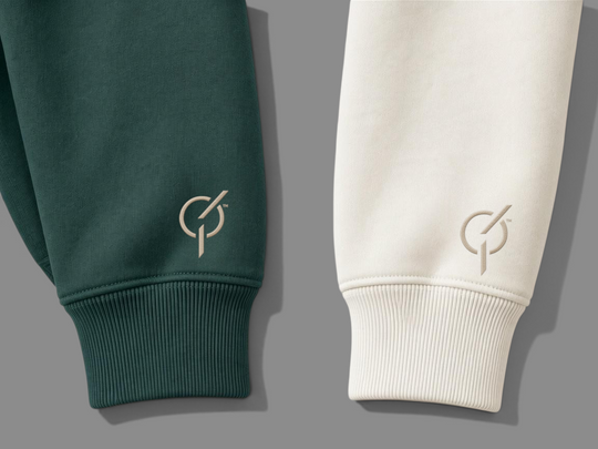 area 609 organic cotton quarter zip sleeves in ivy green and parchment with signature sand embroidery on cuffs