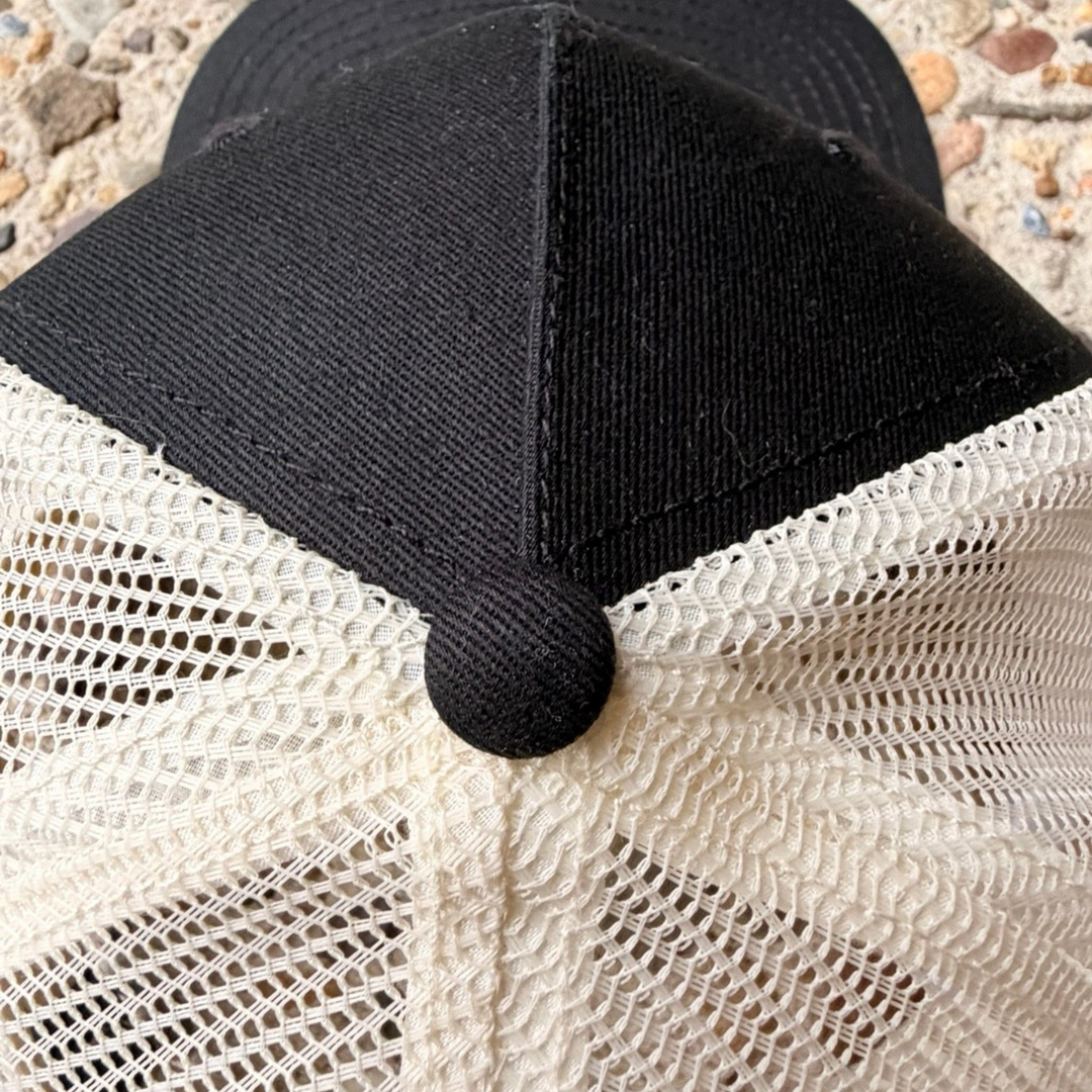 area 609 The Founders trucker hat in black cotton with an ecru polyester mesh back and top button detail