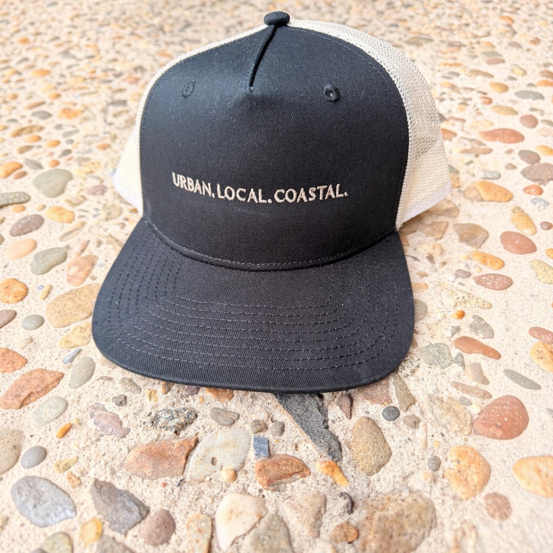 area 609 black and ecru mesh trucker hat with flat peak and Urban, Local, Coastal embroidery on the front