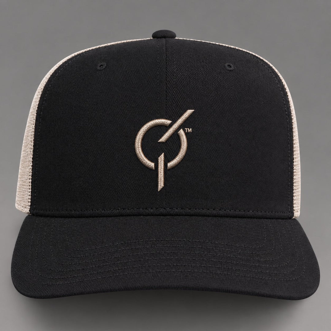 area 609 The Core Trucker hat in black and oyster with a raised puff embroidered emblem and mesh back panels.