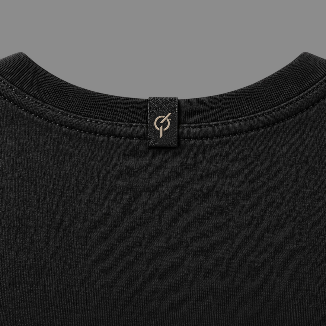 area 609 The Standard Tee Dress in black cotton with a ribbed crew neck and branded logo tab on the back collar