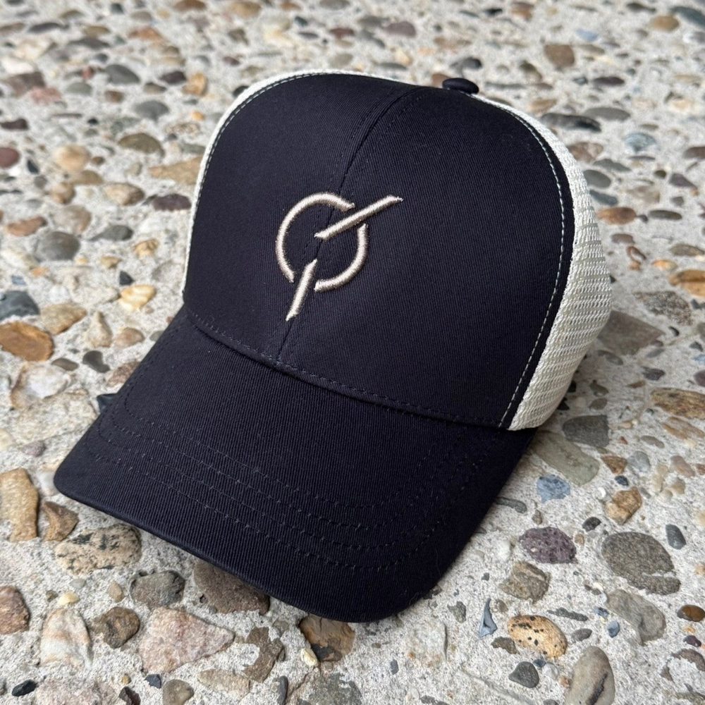 area 609 The Core Trucker hat in black organic cotton with oyster mesh back and raised puff embroidered emblem