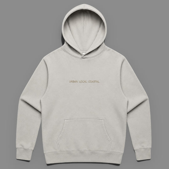 area 609 The Core Hoodie in faded bone cotton-blend fleece with drop shoulders, kangaroo pocket, and embroidery.