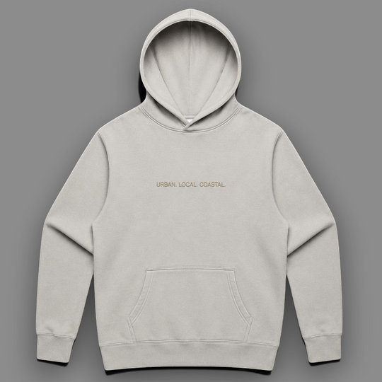 area 609 The Core Hoodie in faded bone cotton-blend fleece with drop shoulders, kangaroo pocket, and embroidery.