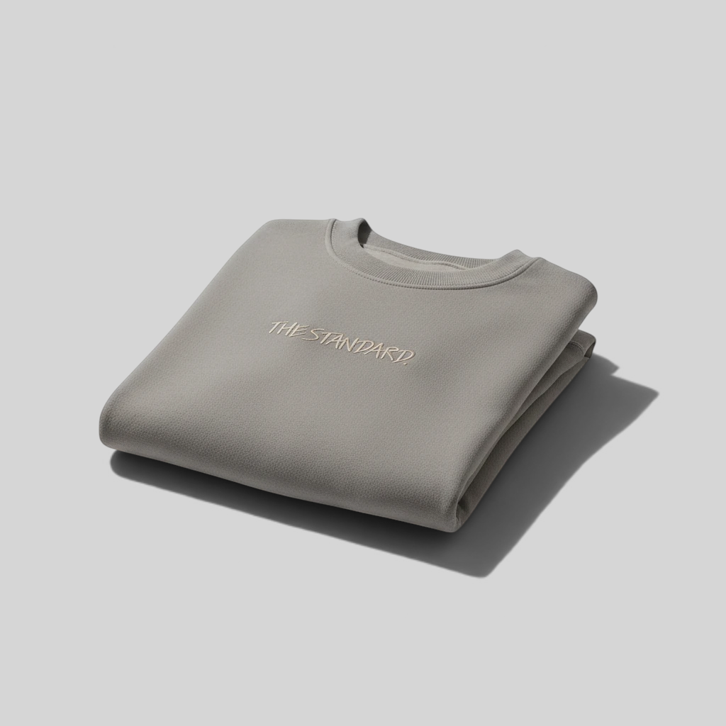 area 609 The Standard Faded Crew sweatshirt in ash grey with embroidered chest logo, folded on white background