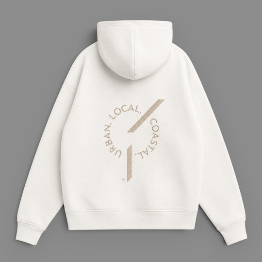 Back view of an area 609 The Founders Hoodie in parchment organic French terry with embroidered logo detail.