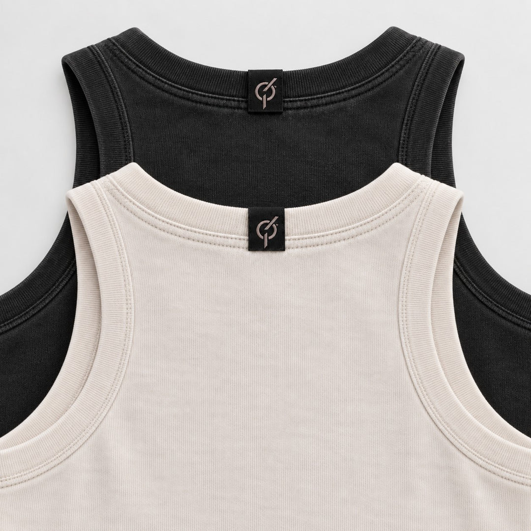 area 609 The Standard Rib tank tops in black and beige with ribbed necklines and branded back neck labels