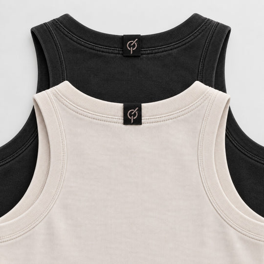 area 609 The Standard Rib tank tops in black and beige with ribbed necklines and branded back neck labels