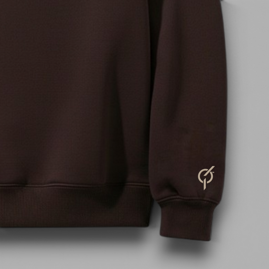 area 609 The Preservation Arch Crew sweatshirt in chestnut brown with a small logo detail on the sleeve cuff