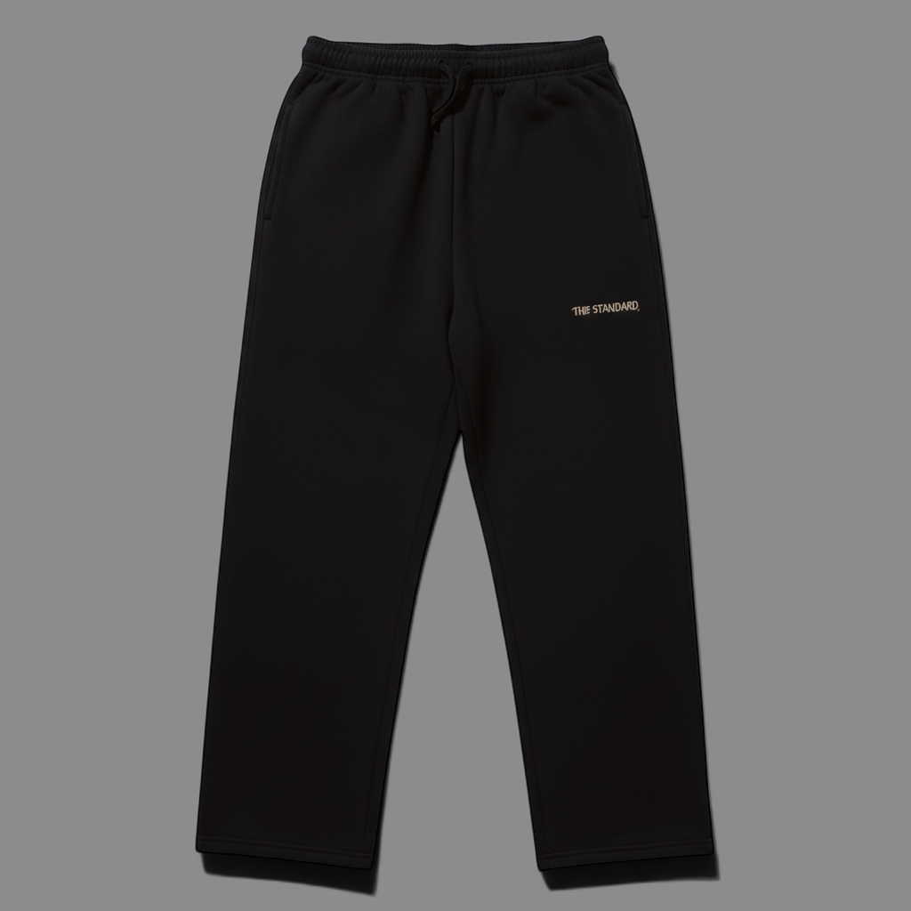 area 609 black heavyweight cotton blend track pants with a relaxed fit, elastic drawstring waist, and cuffless hem.